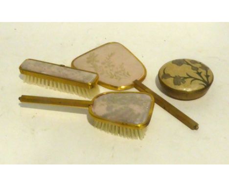 A GILT METAL LADY'S DRESSING TABLE THREE PIECE BRUSH AND MIRROR SET AND A SIMILAR TRINKET BOX 