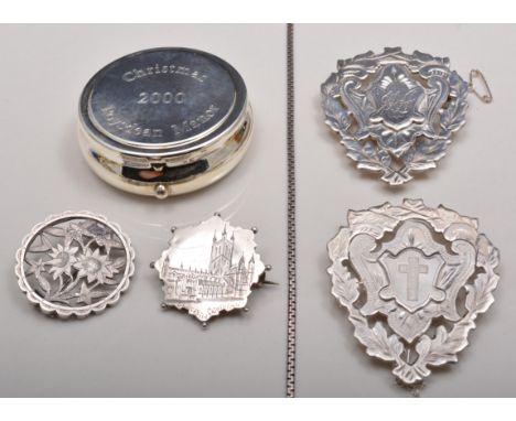 Two silver brooches, two fob like brooches, a white metal box link chain and a souvenir compact, Roysdean Manor.