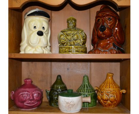 Sadlers olive glazed Chinaman tea caddy, 20cm and a collection of novelty biscuit jars, pickle jars and covers, named cucumbe
