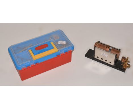Two items, stationary steam engine part built, plastic box containing steam components.