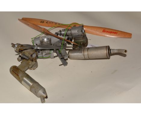 Three R/C glow engines, for spares or repair, including 8 assorted propellors.