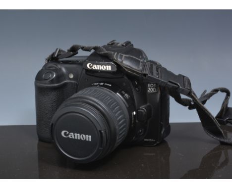 Canon EOS 20D camera, with an 18-55mm lens, in a soft case.