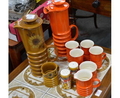 Carltonware coffee set, orange coloured, comprising a coffee pot, 34cm, milk jug, sugar bowl and four mugs, together with ano