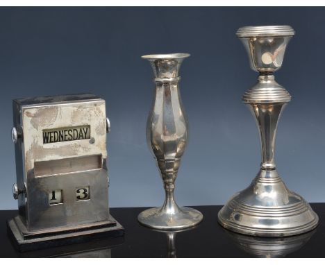 Silver faced and ebonised perpetual calendar, Birmingham 1948, 12cm, a silver candlestick and a Continental silver spill vase