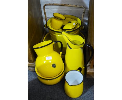 Collection of yellow enamel wares, including a slop pail, basin, ewer, soap dish, jug etc.