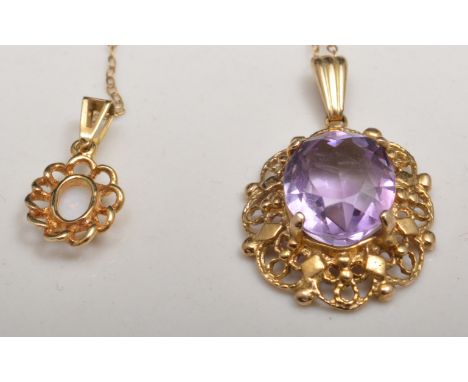 9ct hallmark gold amethyst set pendant, on a trace link chain and an opal claw set, yellow metal pendant on a trace link chai