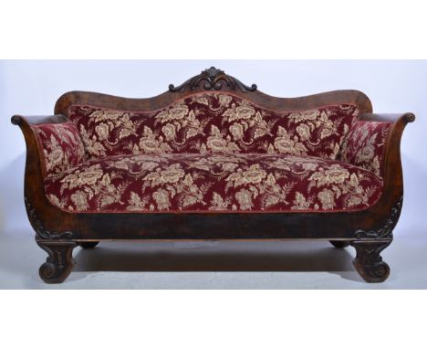Victorian mahogany sofa, shaped back with carved scroll cresting, sculptured floral pattern burgundy upholstery, scrolled fee