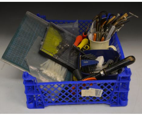 Plastic tray with modelling knives, drill and tools.