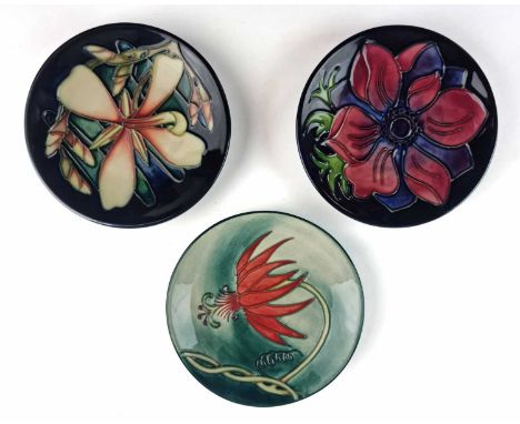 Three Moorcroft pin dishes or coasters, comprising two designed by Sian Leeper; the first dated 2000 and a numbered edition '