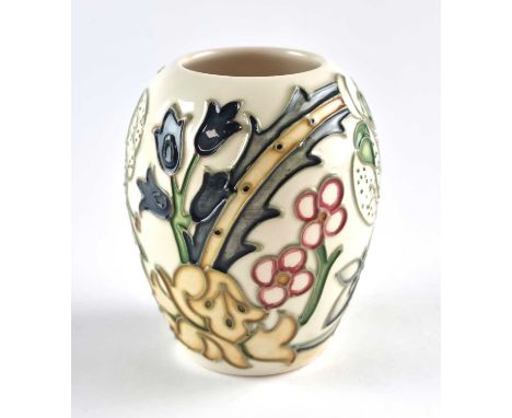 A Moorcroft 'Golden Lily' vase with ivory ground, first designed in 1993, painted and impressed marks, 9.5cm high. Boxed.Prov