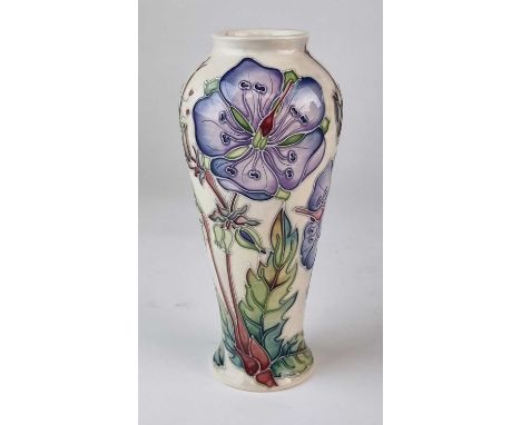 A Moorcroft 'Meadow Cranesbill' vase designed by Alicia Aimson, dated 2002, signed by the artist to the base, 21cm high.

Goo