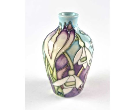 A miniature Moorcroft vase designed by Jeanne McDougall, dated 1999, tubelined with white snowdrops and other flowers against