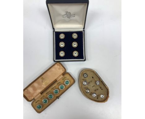 Three cased sets of enamel decorated buttons, two with mother of pearl decoration 