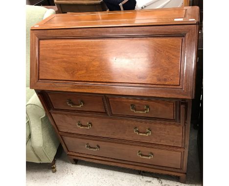A modern Chinese cherry wood bureau, the sloping fall enclosing a basic fitted interior over two short and two long graduated
