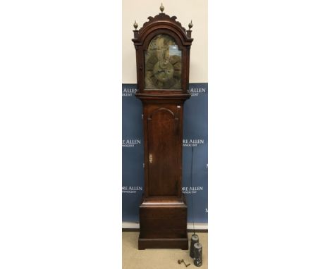 An 18th Century oak cased long case clock, the eight day movement with brass arch dial and "Tempus Fugit Father Time" automat