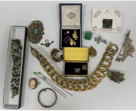 A box of mainly costume jewellery to include a silver brooch as a horse and rider, white metal brooch as a spray of wild flow