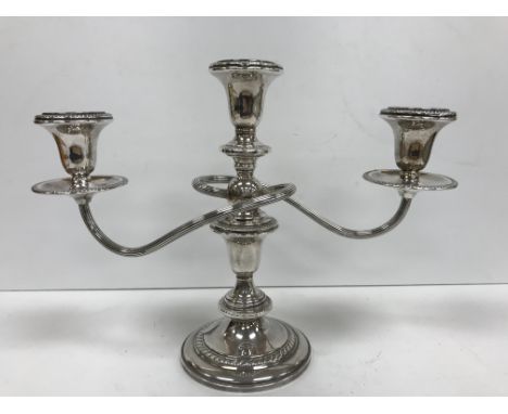 A Hamilton sterling silver three light two branch table candelabrum with gadrooned and reeded decoration, raised on a circula