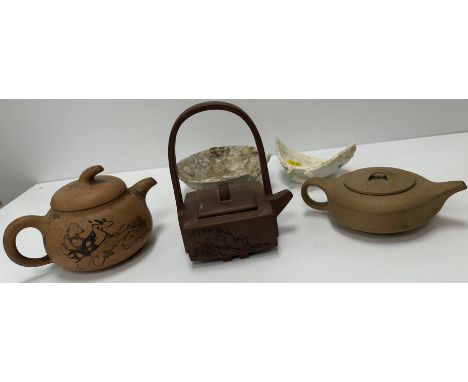 Three various Chinese Yi Xing teapots including a square form teapot with figural decoration and script to sides, stamp mark 