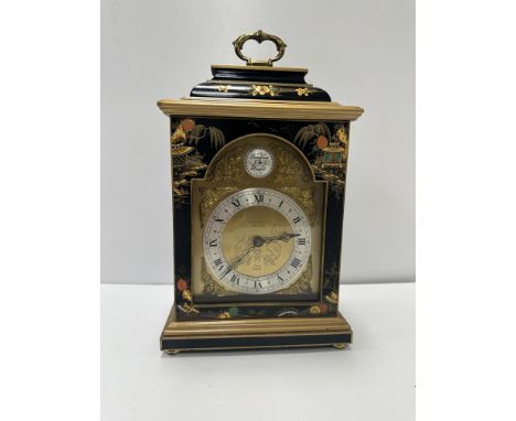 A modern black lacquered and chinoiserie decorated mantel clock in the 18th Century manner, the movement by Elliott of London