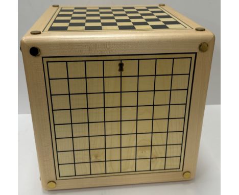 An Alison Henry game cube, each side printed with various games boards including backgammon, chess, noughts and crosses, etc,