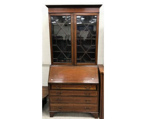 An Edwardian mahogany and satinwood banded bureau bookcase in the Sheraton Revival taste, the top with moulded cornice over t