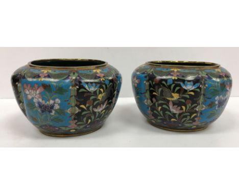 A pair of Chinese cloisonné jardinieres of oval squash form with all over floral pattern decoration on a black/turquoise pane