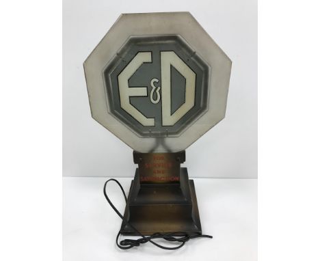 A vintage advertising lit sign "E&amp;D for service and satifaction" with octagonal frosted glass light on a stepped pedestal