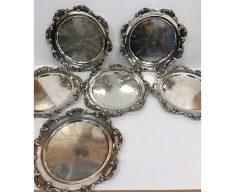 A set of six sterling silver plates with scrolling acanthus decoration in the Rococo style stamped verso "W" within a wreath,