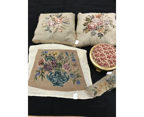 A box containing two tapestry cushions with floral design and fringing, one gilt footstool with fabric covering, one tapestry