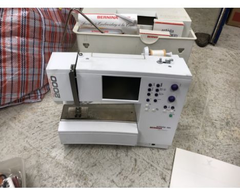 A Bernina "Artista" 180 electric sewing and embroidery machine, together with manual, explanatory DVDs, various attachments, 