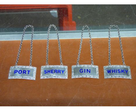 FOUR HM BIRMINGHAM SILVER AND BLUE ENAMEL SPIRIT LABELS 'GIN, PORT, WHISKY AND SHERRY' RESPECTIVELY  