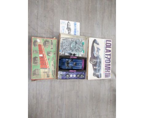 A boxed Tamiya 1:12 scale Lola T-70 MkIII plastic model kit and a Brickplayer brick building set