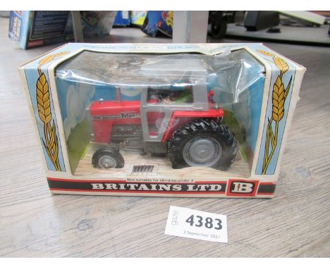 A boxed diecast Britains 9522 Massey Ferguson 595 tractor 