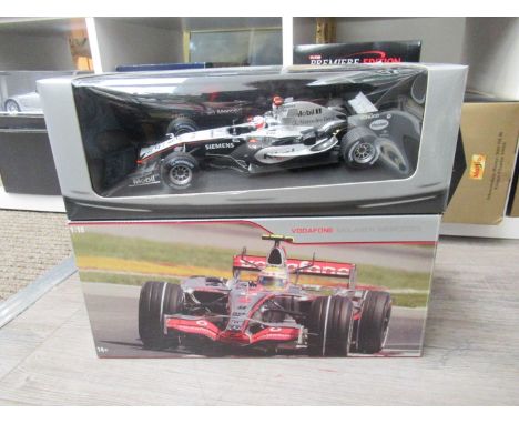 Two 1:18 scale diecast racing cars to include Hot Wheels Lewis Hamilton MP 4-22, Canadian Grand Prix, First Career Victory an