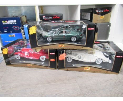 Three boxed Maisto Premiere Edition 1:18 scale diecast cars to include Aston Martin DB7 Vantage and two Mercedes-Benz 500 K T