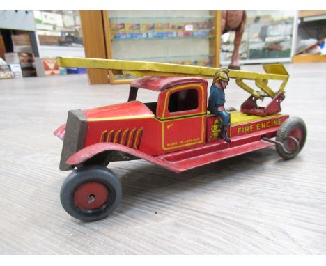 A Wells tinplate clockwork fire engine 