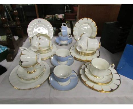 An 18 piece and a 16 piece gold decorated tea sets together with 4 cups and saucers