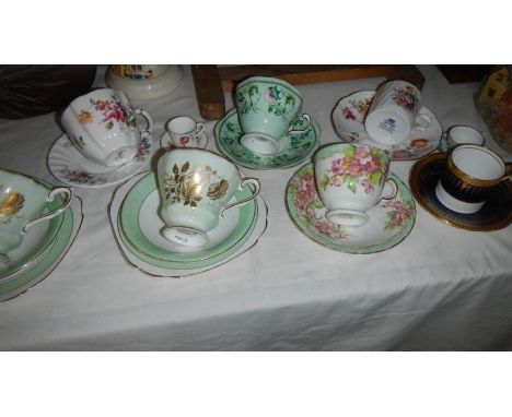 A quantity of assorted tea cups and saucers