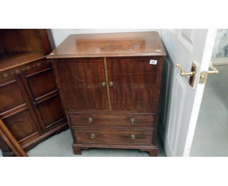 A mahogany inlaid commode