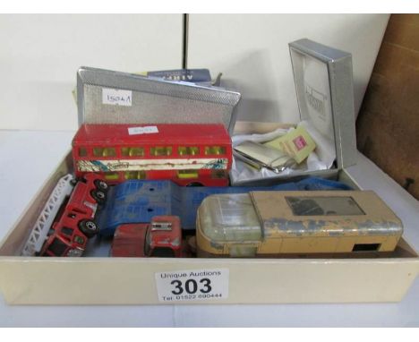 A mixed lot including die cast models, lighter etc