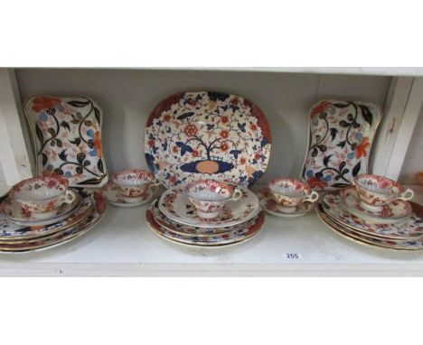 A shelf of tea and dinnerware