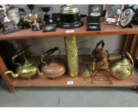 A shelf of brass and copper