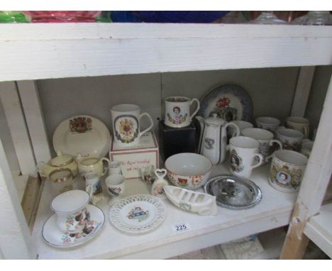 A shelf of commemorative china etc