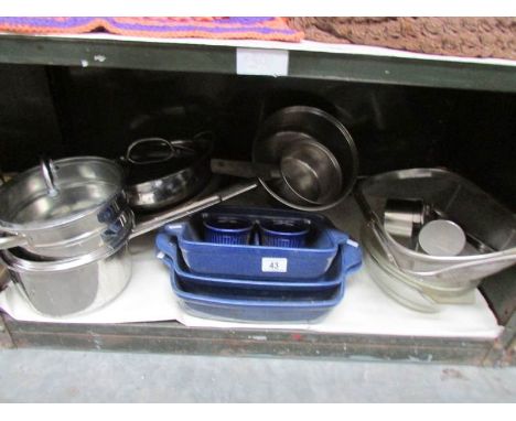 A shelf of kitchen ware