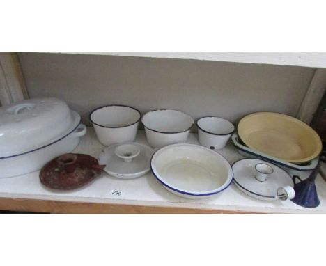 A shelf of enamel ware