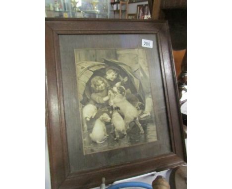 An oak framed and glazed print of children playing with a dog and puppies