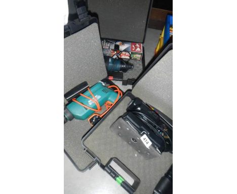 2 cased drills and a cased sander