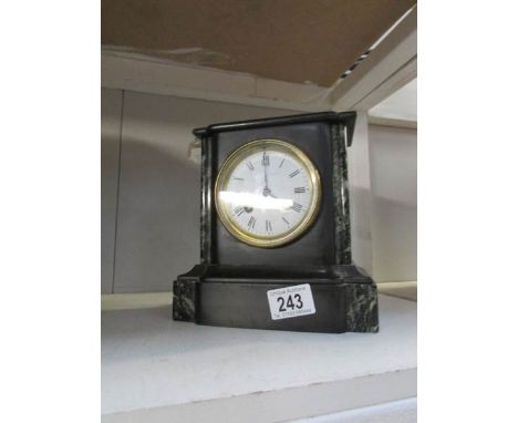 A black marble mantel clock