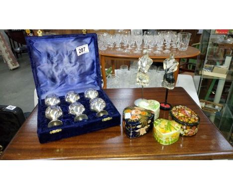 4 trinket boxes, 2 figures of mannequins and a cased set of 6 silver plate goblets