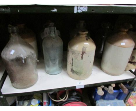 A shelf of stoneware jars etc